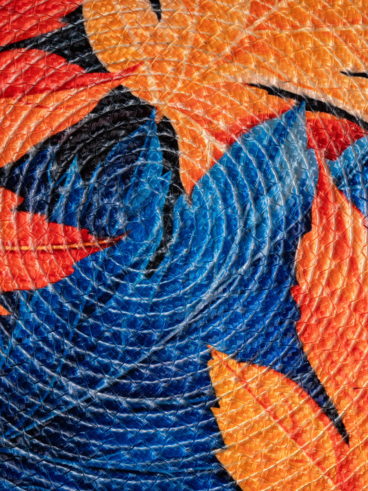 A Decorative placemats with printed leaves and blue background