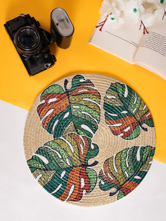 A printed cotton Table mat featuring a leaf design.