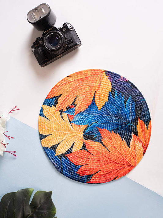 A Decorative placemats with printed leaves and blue background